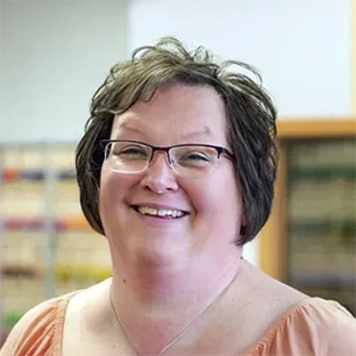 A headshot of Jenny Van Kirk, a Front Desk Manager at Dunham-Fritz Chiropractic
